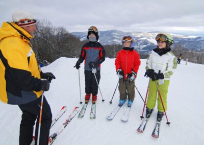 students and instructor at a ski school